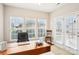 Home office with a desk, chair, and plenty of natural light at 7206 Sandown Ct, Harrisburg, NC 28075