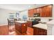 Kitchen with wood cabinets, an island, and stainless steel appliances at 7206 Sandown Ct, Harrisburg, NC 28075