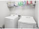 Laundry room with washer, dryer, and ample shelving at 7206 Sandown Ct, Harrisburg, NC 28075