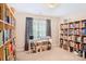 Spacious library with floor-to-ceiling bookshelves at 7206 Sandown Ct, Harrisburg, NC 28075