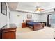 Main bedroom with a wooden sleigh bed and ceiling fan at 7206 Sandown Ct, Harrisburg, NC 28075