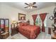 Bedroom features a ceiling fan, a large window with stylish curtains and a framed mirror on the wall at 10080 Highland Creek Cir, Indian Land, SC 29707