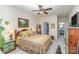 Cozy bedroom featuring a ceiling fan, complemented by the ensuite bathroom and walk-in closet at 10080 Highland Creek Cir, Indian Land, SC 29707