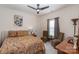 Comfortable bedroom showcases a ceiling fan and a large window providing natural light at 10080 Highland Creek Cir, Indian Land, SC 29707