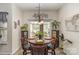 Bright dining area features sliding glass doors to the back yard and stylish decor at 10080 Highland Creek Cir, Indian Land, SC 29707