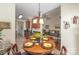 Inviting dining area showcases a wooden table and decor leading to the open kitchen and living room at 10080 Highland Creek Cir, Indian Land, SC 29707