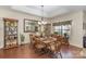 Charming dining room offers natural light and decorative shelving for storage and display at 10080 Highland Creek Cir, Indian Land, SC 29707