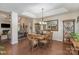 Formal dining room boasts hardwood floors, a tray ceiling, and elegant chandelier at 10080 Highland Creek Cir, Indian Land, SC 29707