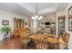 Spacious dining room with hardwood floors, china cabinet and easy access to other living spaces at 10080 Highland Creek Cir, Indian Land, SC 29707