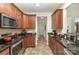 Well-lit kitchen featuring granite countertops, stainless steel appliances, and ample cabinet space at 10080 Highland Creek Cir, Indian Land, SC 29707