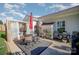 Relaxing outdoor patio with a dining area, seating area, and manicured landscaping at 10080 Highland Creek Cir, Indian Land, SC 29707