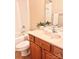 Bathroom featuring a light pink sink, tub, shower, and decorative plants at 11264 Hyde Pointe Ct, Charlotte, NC 28262