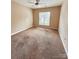 Bedroom with carpet, ceiling fan, and natural light from the window at 11264 Hyde Pointe Ct, Charlotte, NC 28262