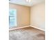 Neutral bedroom with carpet, window, and ample natural light at 11264 Hyde Pointe Ct, Charlotte, NC 28262