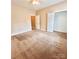 Neutral bedroom with carpet, closet, ceiling fan and two doors at 11264 Hyde Pointe Ct, Charlotte, NC 28262