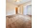 Spacious carpeted bedroom with a walk-in closet and adjacent door at 11264 Hyde Pointe Ct, Charlotte, NC 28262