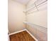 Walk-in closet features wood floors and wire shelving at 11264 Hyde Pointe Ct, Charlotte, NC 28262