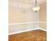 The dining room features wood floors, neutral walls, and a classic light fixture at 11264 Hyde Pointe Ct, Charlotte, NC 28262