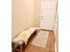 Inviting entryway features a bench, a patterned rug, and access to additional rooms at 11264 Hyde Pointe Ct, Charlotte, NC 28262