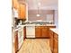 Bright kitchen features wood cabinets, white appliances, and an open layout at 11264 Hyde Pointe Ct, Charlotte, NC 28262
