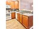 Bright kitchen features wood cabinets, modern appliances, and an open layout at 11264 Hyde Pointe Ct, Charlotte, NC 28262