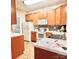 Charming kitchen features wood cabinets, tile backsplash, and modern appliances at 11264 Hyde Pointe Ct, Charlotte, NC 28262