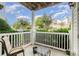 Relaxing outdoor patio area with white railings, comfortable seating, and views of lush greenery at 11264 Hyde Pointe Ct, Charlotte, NC 28262