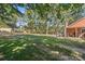 Expansive backyard with lush green grass and mature trees at 6909 Green Haven Ln, Monroe, NC 28110