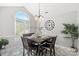 Bright dining room with modern chandelier, large window, and luxury flooring at 6909 Green Haven Ln, Monroe, NC 28110