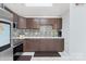 Modern kitchen featuring stainless steel appliances, stylish backsplash, and ample counter space at 6909 Green Haven Ln, Monroe, NC 28110
