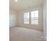 Spacious bedroom with carpeted floor and large windows at 10105 Mamillion Dr, Huntersville, NC 28078