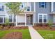 Inviting front entrance with a charming walkway and a well-manicured yard, complemented by lush landscaping at 10105 Mamillion Dr, Huntersville, NC 28078