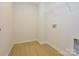 Bright laundry room with wire shelving and vinyl flooring at 10105 Mamillion Dr, Huntersville, NC 28078