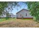 Exterior rear view of home featuring spacious yard and utility equipment at 3004 Ridge Ave, Charlotte, NC 28208