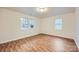 Bedroom with natural light, wood-look flooring, and a neutral color scheme at 3004 Ridge Ave, Charlotte, NC 28208