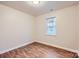 Bedroom featuring natural light, wood-look floors, and a closet at 3004 Ridge Ave, Charlotte, NC 28208