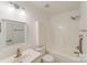 Bright white bathroom features a shower-tub combo, vanity, and toilet at 563 Goldstaff Ln, Charlotte, NC 28273