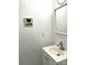 Small bathroom with white vanity and textured walls at 563 Goldstaff Ln, Charlotte, NC 28273