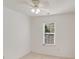 The bedroom has a ceiling fan and natural light from the window at 563 Goldstaff Ln, Charlotte, NC 28273