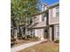 Charming townhome with neutral siding, stone accents, well-maintained landscaping, and inviting walkway at 563 Goldstaff Ln, Charlotte, NC 28273