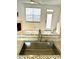 Close-up of sink and backsplash in kitchen with stainless steel appliances at 563 Goldstaff Ln, Charlotte, NC 28273