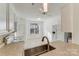 Bright kitchen with white cabinetry, a tiled backsplash, and stainless-steel appliances for modern convenience at 563 Goldstaff Ln, Charlotte, NC 28273