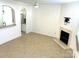 Spacious living room with fireplace and opening to the kitchen bar at 563 Goldstaff Ln, Charlotte, NC 28273