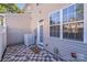 Private patio area featuring decorative tiled flooring, a white privacy fence, and access to the home at 563 Goldstaff Ln, Charlotte, NC 28273