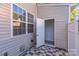 Outdoor patio with tiled floor, window, and access door, perfect for enjoying private outdoor space at 563 Goldstaff Ln, Charlotte, NC 28273