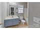 The bathroom features a single vanity, toilet, tub, and window for natural light at 8403 Spirea Ct, Charlotte, NC 28215