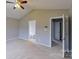 Spacious bedroom featuring a ceiling fan and access to the bathroom and walk-in closet at 8403 Spirea Ct, Charlotte, NC 28215