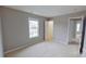 This bedroom features neutral walls and carpet, plus a double-hung window for natural light at 8403 Spirea Ct, Charlotte, NC 28215