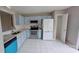 Charming kitchen showcasing blue cabinets, stainless steel appliances, and granite counters at 8403 Spirea Ct, Charlotte, NC 28215