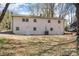 Large backyard showcasing a two-story home with painted-white brick exterior at 919 N Weldon St, Gastonia, NC 28052